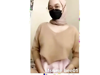 Watch this hijab-wearing teenager with large innate mammories gusto herself in a insatiable hijab-wearing session